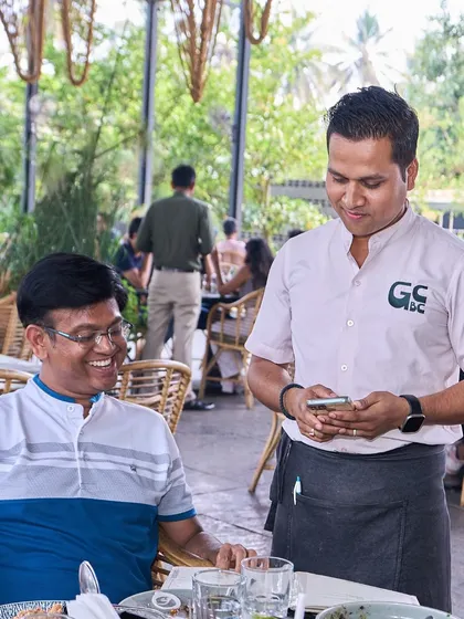 A guest enjoying a conversation with our friendly staff, who are always happy to help.