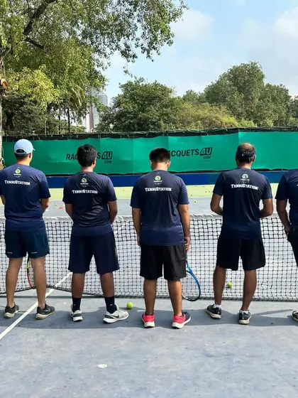 Our team united on the court, facing the net together. This represents our collective commitment to the game and to each other.