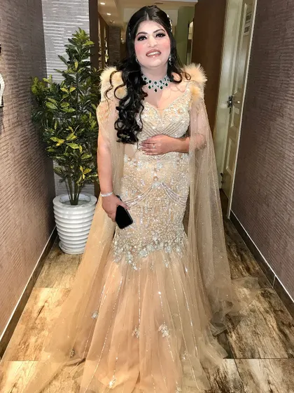 A full-length view of the stunning fish-cut gown.