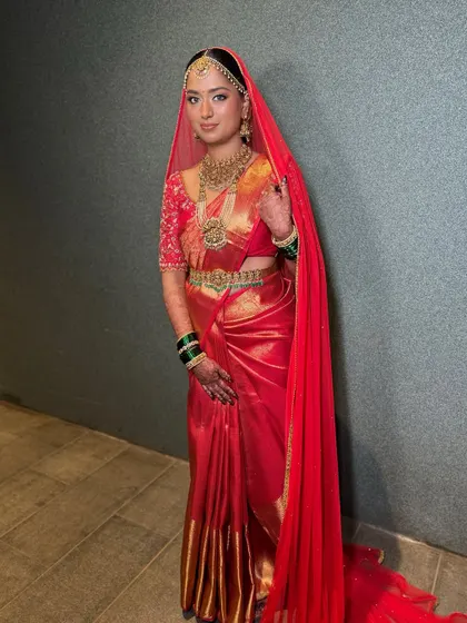 The bride with her veil, adding a layer of traditional grace to her already stunning look.