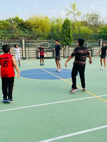 A warm-up drill involving passing and movement to get players ready for the session.