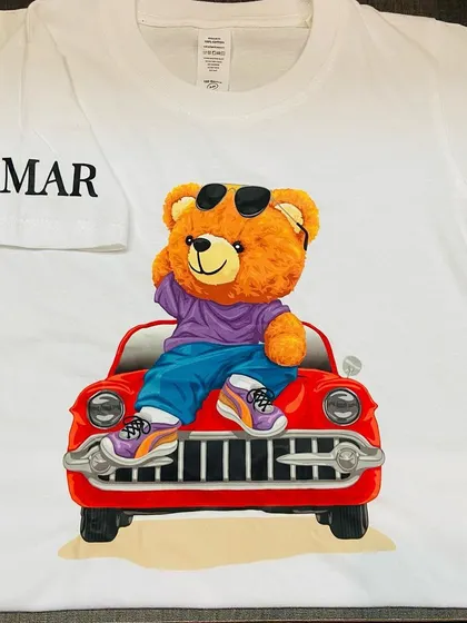 A close-up of our cool teddy bear t-shirt, showing the detail in the print and the name on the sleeve.