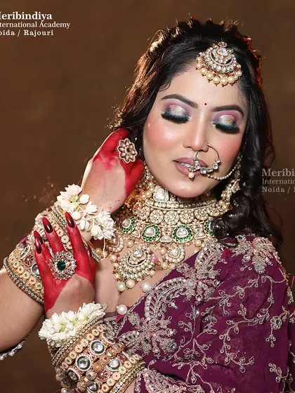 Another beautiful shot of the bride, showcasing the balance between the elaborate jewelry and the floral hairstyle.