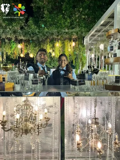 A split-screen view of our elegant bar setup, featuring a lush green backdrop and classic chandeliers. Our bartenders are ready to serve in this beautiful, upscale environment.