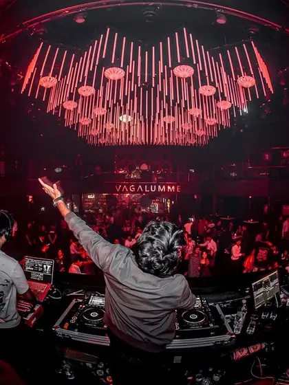 The red-drenched, high-energy atmosphere of Vagalumme. This fish-eye photo shows the contagious, electric vibes of a night in Goa.