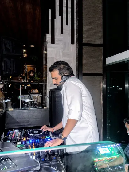A side profile of me at the Koishii gig, focused on the setup.