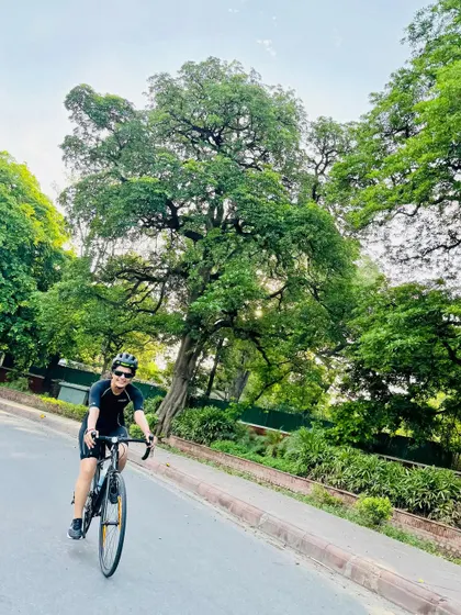 Riding through the green avenues of Delhi.