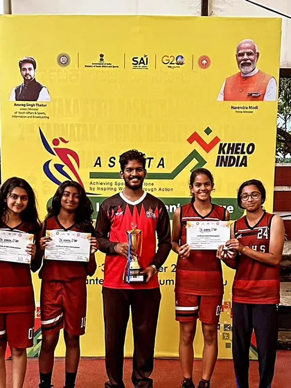 Our coach and the U17 girls team with their 3rd place trophy from the Khelo India games.