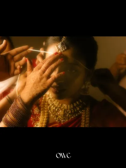 An artistic shot of the 'Thali' or sacred thread being prepared for the ceremony.