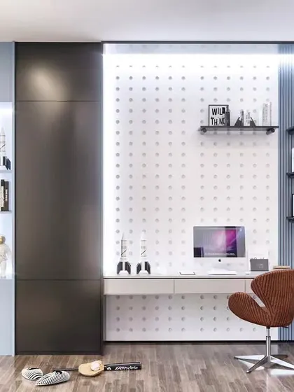 A sophisticated home office design with dark, sleek cabinetry and a built-in desk. The pegboard-style wall and integrated lighting create a modern and organized workspace.