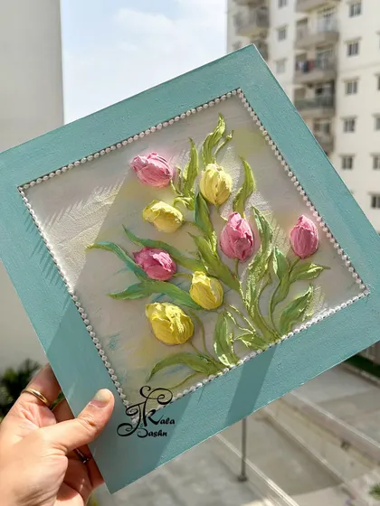 Another shot of my first tulip piece, held up to catch the natural light. The sunlight highlights the 3D quality of the flowers, making them seem to lift off the canvas.