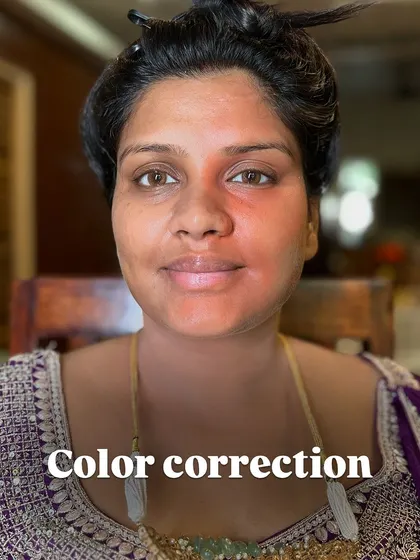 The first step in tackling discoloration is color correction. Here, you can see how I use an orange corrector to neutralize dark circles and pigmentation before applying foundation.
