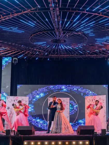 A romantic couple's performance using multiple moving LED screens as a dynamic backdrop, showcasing our use of advanced stage technology.