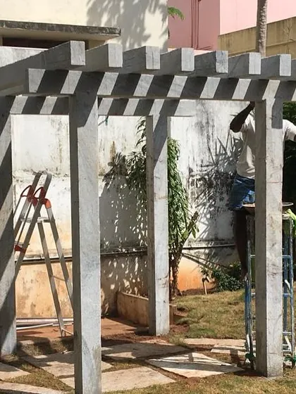 My team putting the finishing touches on a stone pergola installation. These structures are built to last and withstand the elements for years to come.