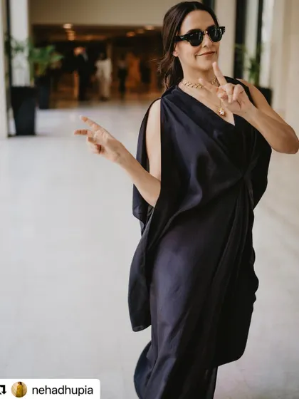 A fun, candid shot of Neha Dhupia. This shows the relaxed and collaborative atmosphere I maintain on set while ensuring the hairstyle remains perfect.