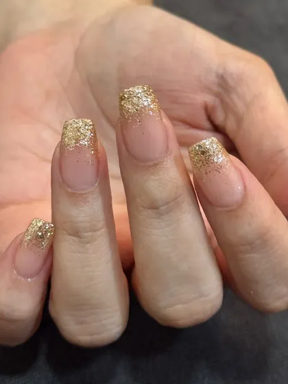 A still shot of the classic gold glitter fade. This look is perfect for any celebration.