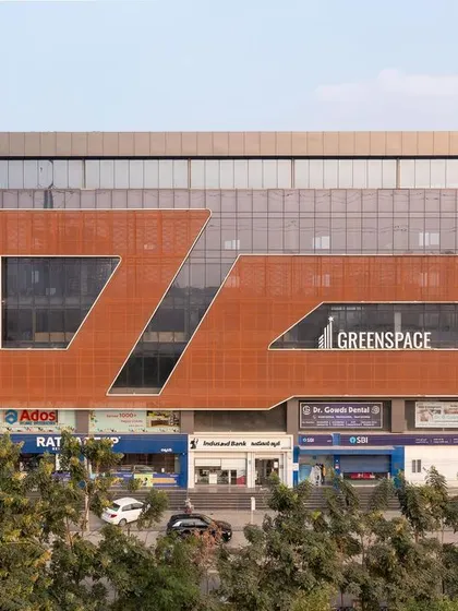 Our commercial work aims to create landmarks. The facade for 'Greenspace' uses a dynamic arrangement of materials and voids to stand out in the cityscape, reflecting a contemporary and forward-thinking identity for the businesses within.