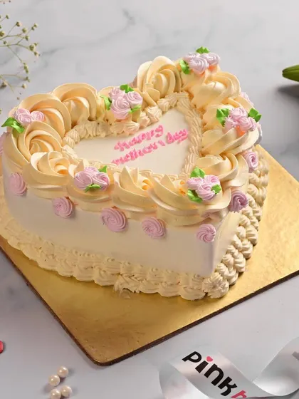 A beautiful heart-shaped cake with delicate buttercream roses, made especially for Mother's Day. It's a classic and elegant way to show your love and appreciation.