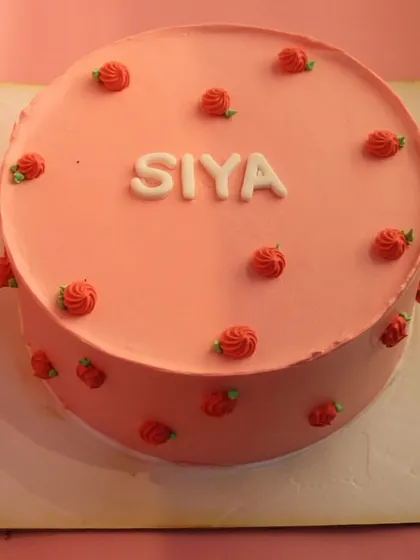 Another view of the "Siya" naming ceremony cake, showing its clean and elegant design.