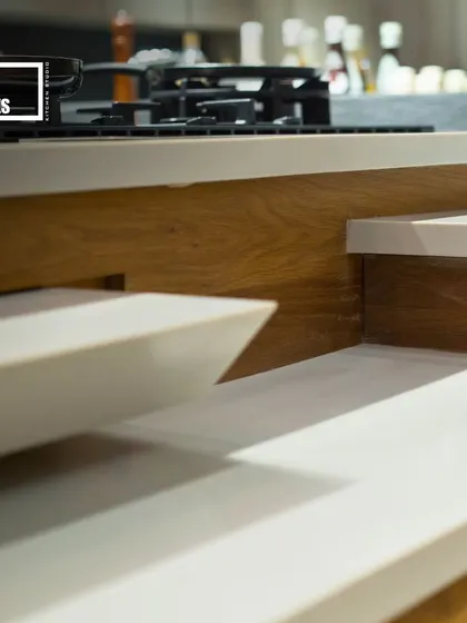 A close-up of the pull-out table mechanism. It's a practical feature that provides extra dining space when needed and tucks away neatly when not in use, perfect for compact Bombay apartments.