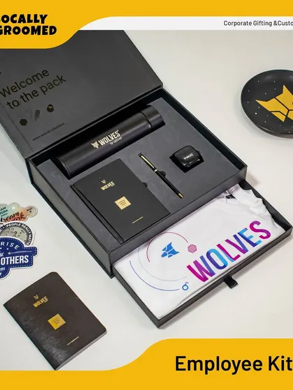 This is the same premium "Wolves" employee kit, shown here to anchor our employee kit category. The thoughtful design includes a special tray for the t-shirt, demonstrating our attention to the unboxing experience.