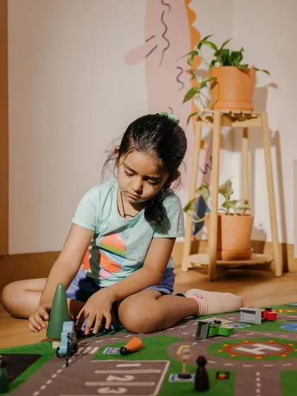 A child engaged in imaginative play in our Makerspace.