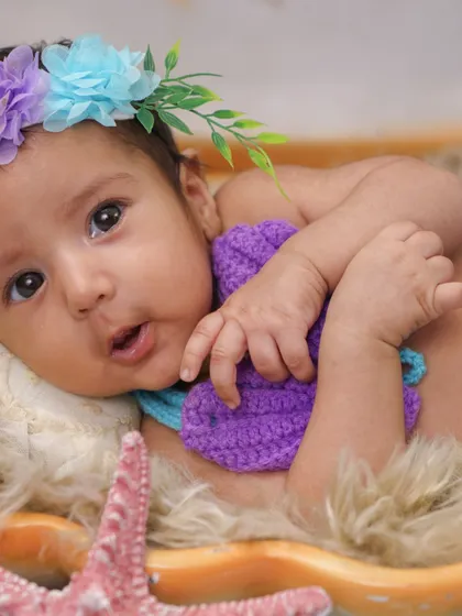 A close-up of the baby mermaid's sweet, expressive face. These alert moments are just as precious as the sleepy ones.