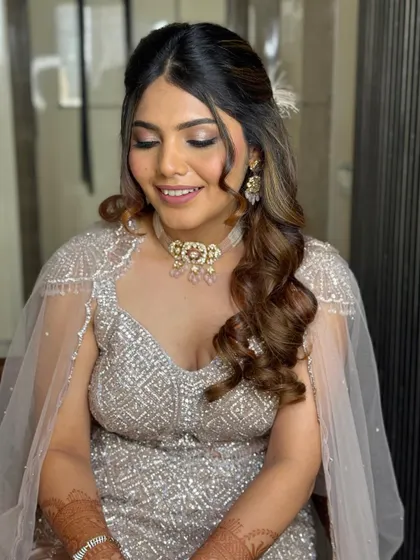 This close-up shows the gentle waves and the way the hair frames the face. It's an elegant choice for any bridesmaid or wedding guest.