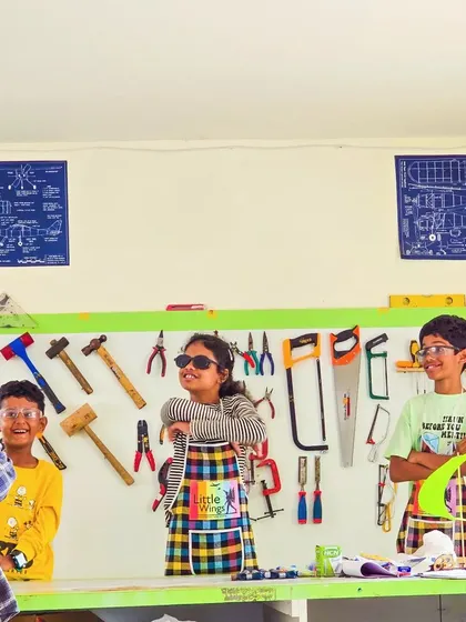 Our little engineers are ready for action! Dressed in aprons and safety glasses, they are excited to start their next project in front of our tool wall.