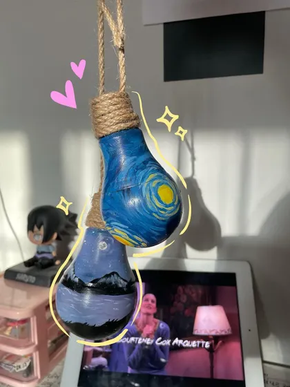 I even paint on lightbulbs. Here are two upcycled bulbs I painted with a Starry Night theme, perfect for unique home decor.