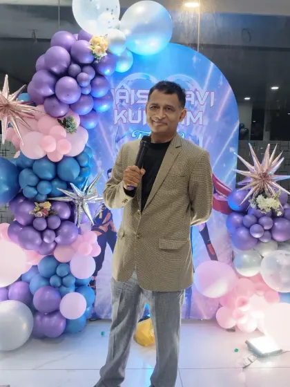 Posing in front of a fantastic space-themed birthday decoration. I'm always prepared to host, no matter how simple or elaborate the party setup is.