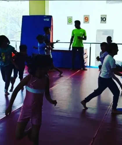 A dynamic shot of our "Tunnel Tag" game in full swing. This activity is great for developing spatial awareness and agility in a playful, non-competitive environment.