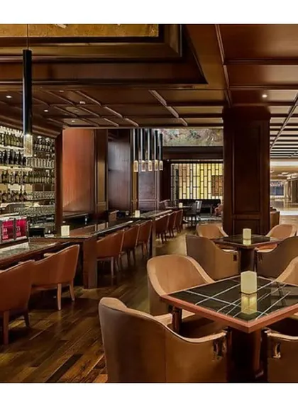 The ambiance of the bar and lounge at the Sheraton Bangalore. We used rich wood paneling, coffered ceilings, and focused pendant lighting to create an intimate, sophisticated atmosphere for guests.