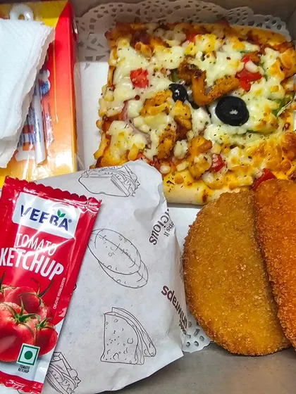 Another example of our popular birthday snack box, featuring a mix of non-veg and veg items to cater to different preferences.