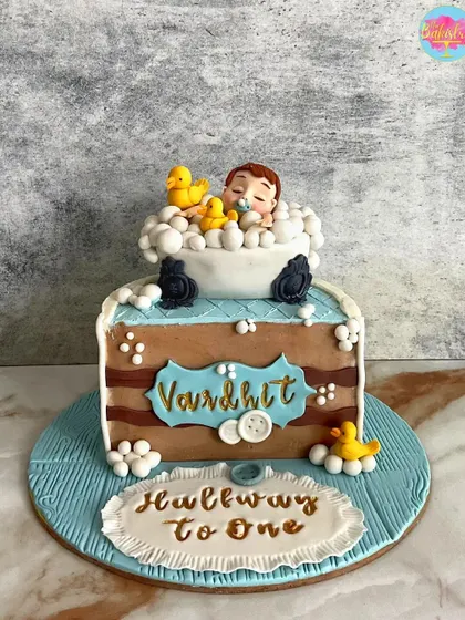 Celebrating 6 months of love with this "Halfway to One" cake for Vardhit. The design features a cute baby in a bathtub full of bubbles and rubber duckies.
