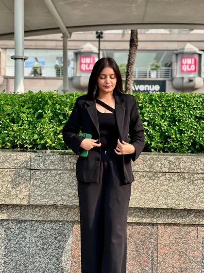 Adjusting my blazer, a routine part of preparing for the day's legal challenges. My focus is always on providing top-tier legal advice and representation.