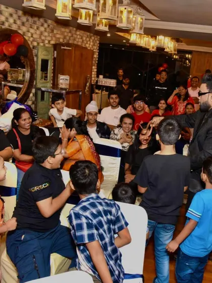 A candid shot of me interacting with the audience. I make sure to move around and engage with everyone, not just those on stage.