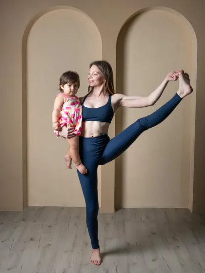 This is what my practice looks like now, and I wouldn't have it any other way. Holding my daughter while in Utthita Hasta Padangusthasana shows how yoga adapts to life. Motherhood has taught me that balance is not just about holding a pose, but about integrating my practice into my life as a new mom.