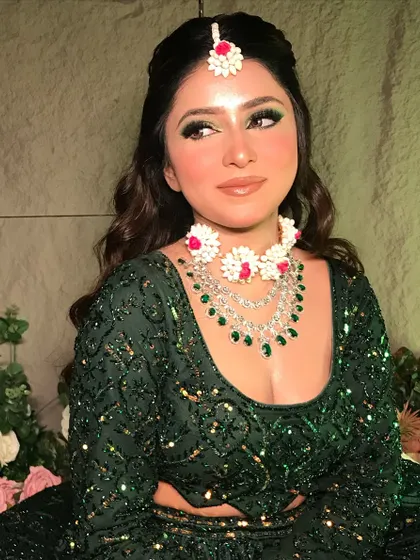 A close-up of my 'Mehendi Vibes' look. The makeup features a beautiful green smokey eye, flawless skin, and is paired with custom floral and diamond jewelry.