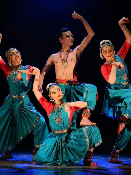 A powerful tableau from 'Tyāgarāja Hṛt Sadana', showcasing the dynamic group formations that are a hallmark of my ensemble choreography. The interplay between dancers creates a rich visual narrative.