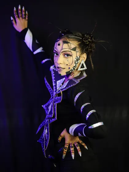 A dynamic pose that highlights the movement and energy of this futuristic look.