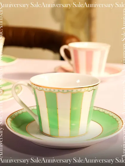 A close-up of my green and white striped teacup and saucer. This piece combines classic design with a fresh, modern color palette, perfect for adding a touch of elegance to your daily routine.