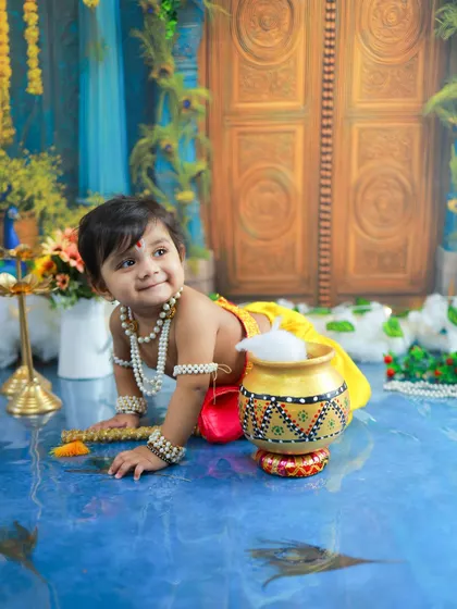 A crawling little Krishna on his way to the butter pot. Capturing these action shots adds a wonderful narrative element to the photo series.