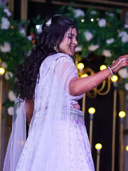 Caught in a moment of dance and celebration. The makeup is designed to be long-lasting and photogenic, even through a night of dancing.