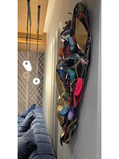 The butterfly sculpture installed in its new home, adding a vibrant, artistic touch to the living space.