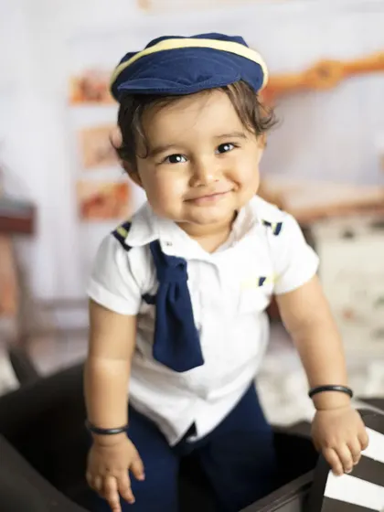 A sweet smile from our little pilot. This theme is perfect for adventurous little boys and girls.
