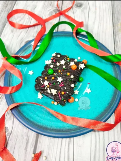 Get into the holiday spirit with my fudgy chocolate Christmas tree brownie. It's decorated with festive sprinkles and makes for a perfect little treat.