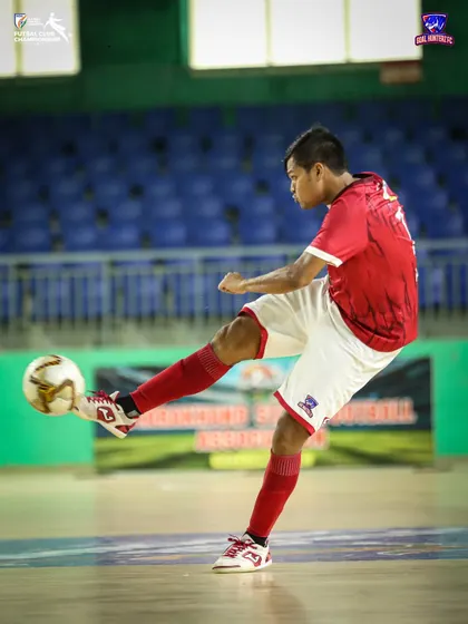 A player taking a shot during the match.