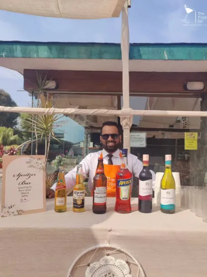 One of our mixologists ready to serve at a beautiful brunch affair. We bring the same level of professionalism and style to daytime events as we do to evening parties.