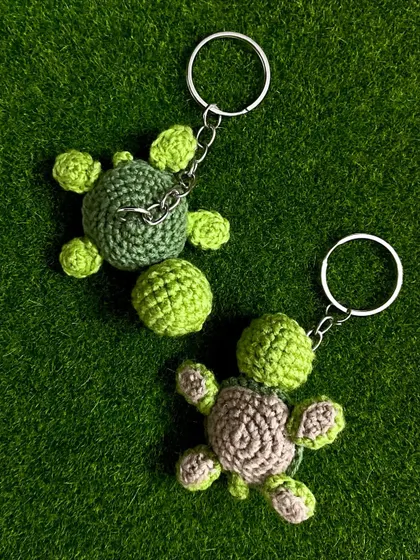 I also offer color variations for my turtle keychains. This one features a light brown shell, showing how you can customize your little friend.